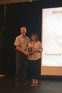 Lucia Varela accepting her Distinguished Achievement Award in Extension. Photo by: K. Windbiel-Rojas